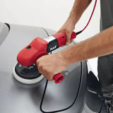 Man using a red FLEX car polisher on a silver car hood for auto detailing