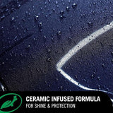 Close-up of water beading on a dark car surface treated with Turtle Wax ceramic infused formula.