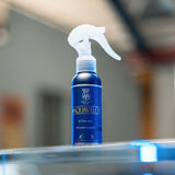 Labocosmetica AQUAVÈLOX Glass Nano Sealant in a blue spray bottle