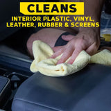 Hand cleaning car interior with yellow microfiber cloth, safe for plastic, vinyl, leather, rubber & screens