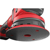 Close-up of a red cordless random orbital polisher for car detailing