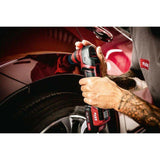 Cordless orbital polisher being used to detail a car's fender for paint correction