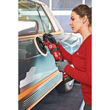 Woman using cordless rotary polisher to detail classic car door