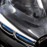 Close-up of swirl marks and scratches on a black car hood before Soft99 polishing.