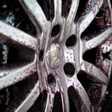 Labocosmetica SIDERO iron remover gel reacting on a dirty alloy car wheel