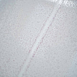 Close-up of Labocosmetica SIDERO iron remover reacting on a car surface with purple residue.