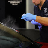 Person applying Labocosmetica AQUAVÈLOX Glass Nano Sealant to a car windshield