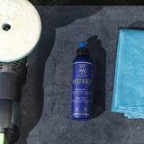 Labocosmetica Vitreo Glass Polish bottle next to a polishing pad and blue microfiber cloth.