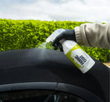 Applying fabric coat protectant spray to car interior fabric for detailing and protection