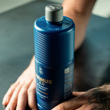Labocosmetica PRÌMUS 2.0 alkaline foam prewash bottle held by hands
