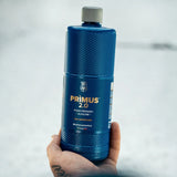 Hand holding a bottle of Labocosmetica PRÌMUS 2.0 alkaline foam prewash.